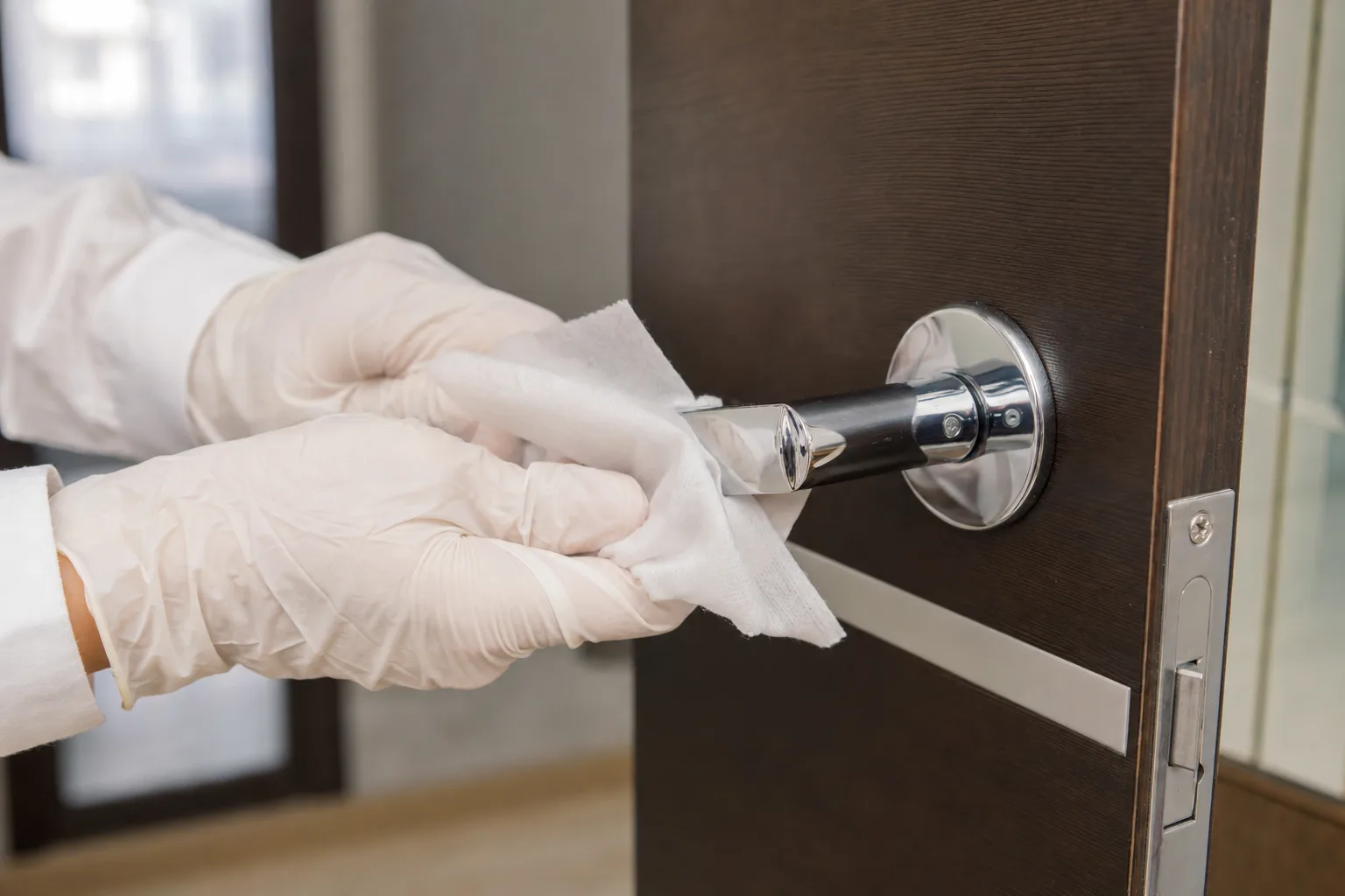 Disinfecting a high touch door handle as part of a disinfection service